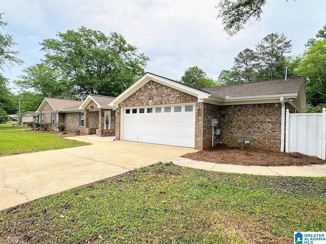 ranch-style home featuring driveway, a front yard, brick siding, fence, and an attached garage