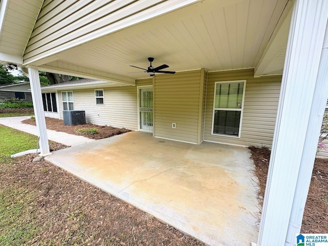 view of patio with ceiling fan, central AC, and an attached carport