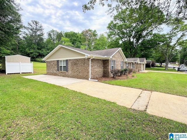 ranch-style house featuring brick siding and a front yard