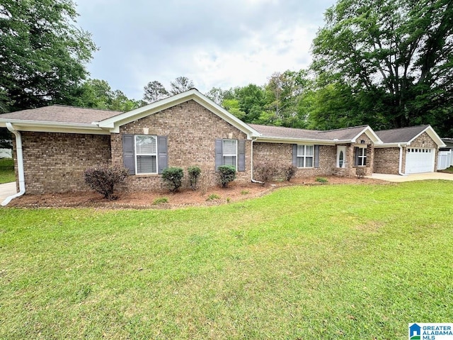 ranch-style home with brick siding, a garage, and a front yard