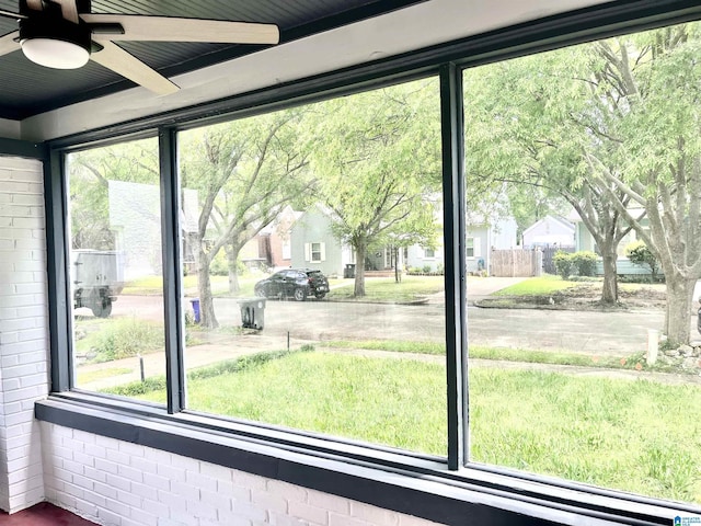 interior space featuring a residential view and a ceiling fan
