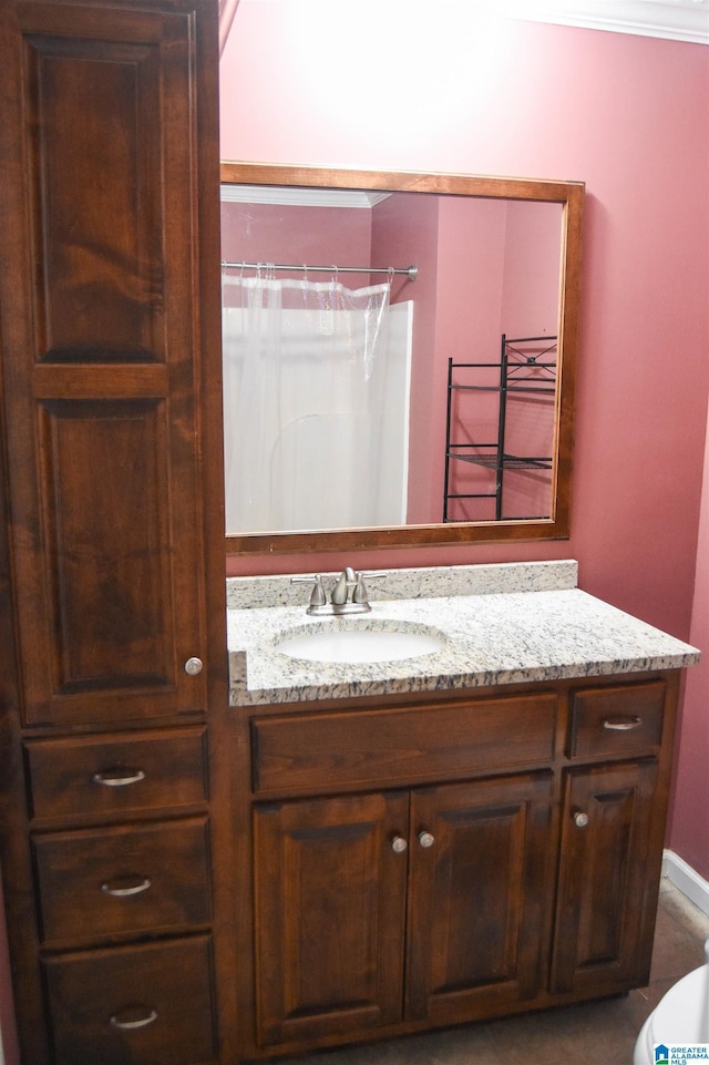 full bath with vanity and curtained shower