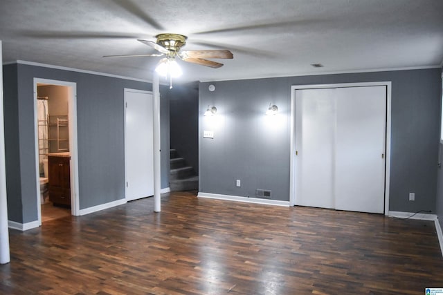 unfurnished bedroom featuring crown molding, baseboards, visible vents, and wood finished floors