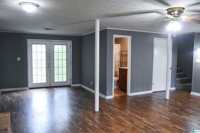 below grade area with baseboards, ornamental molding, french doors, and ceiling fan