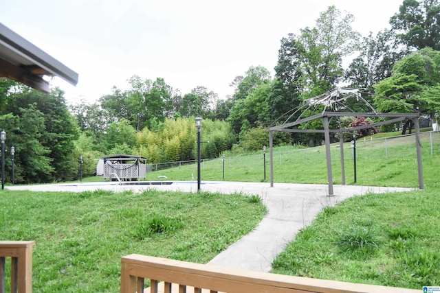 exterior space featuring a gazebo and fence