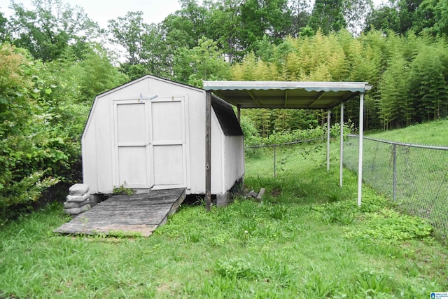 view of shed featuring fence