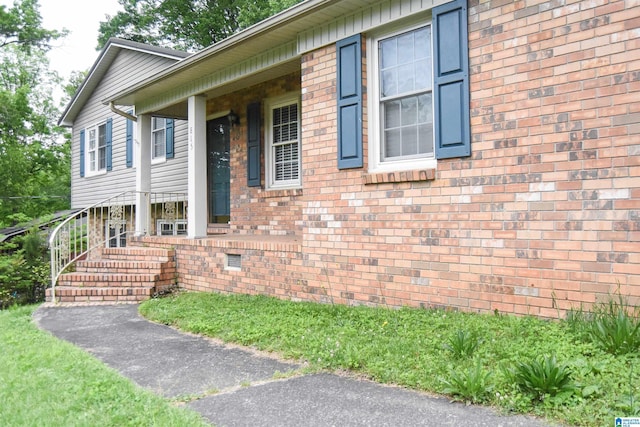 view of front of property featuring brick siding
