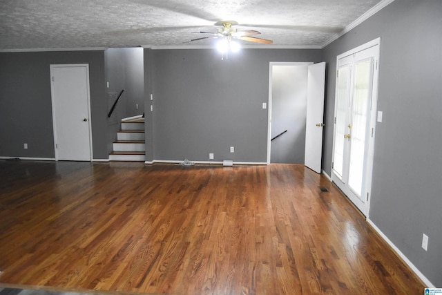 spare room with crown molding, ceiling fan, a textured ceiling, and wood finished floors