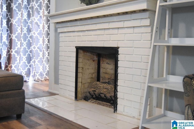 interior details with a brick fireplace