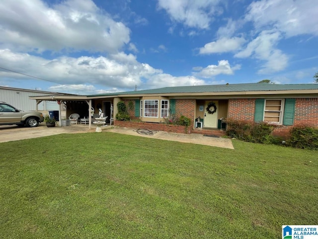 ranch-style house featuring brick siding and a front lawn