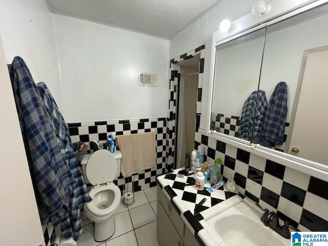 full bathroom featuring tile walls, tile patterned flooring, vanity, and toilet