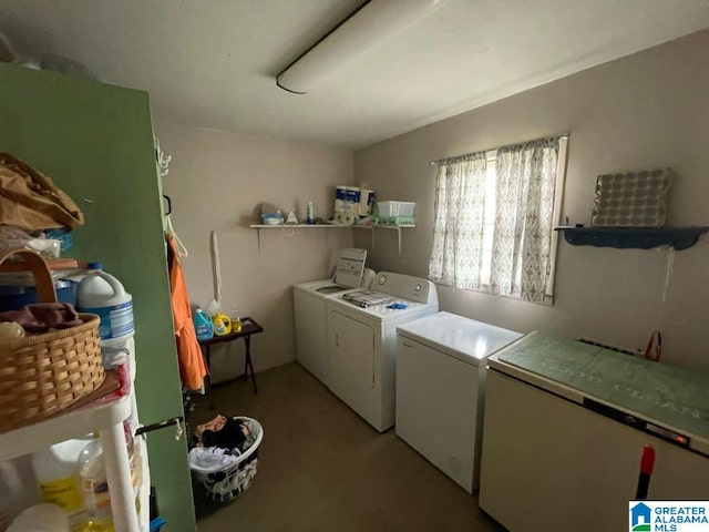 washroom with laundry area and washer and dryer