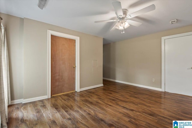 unfurnished bedroom with baseboards, a ceiling fan, and wood finished floors