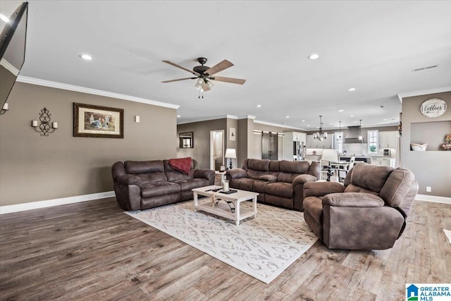 1520 Day Gap Rd, Cullman, AL 35057 - living area featuring recessed lighting, baseboards, wood finished floors, and ceiling fan with notable chandelier