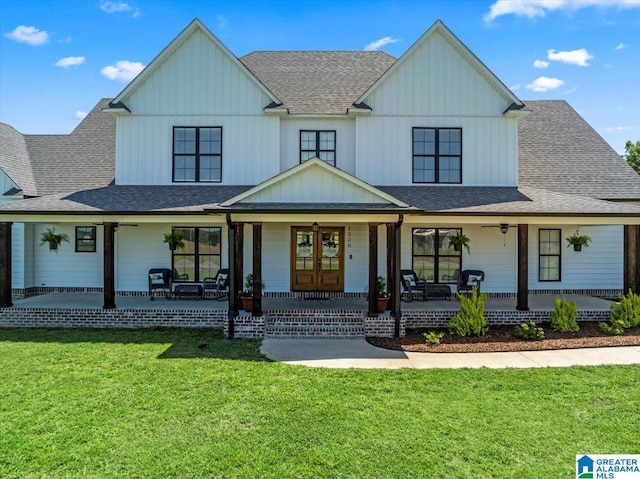 1520 Day Gap Rd, Cullman, AL 35057 - view of front facade with a front lawn, ceiling fan, a shingled roof, board and batten siding, and a porch