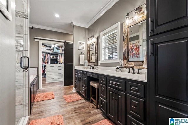 1520 Day Gap Rd, Cullman, AL 35057 - full bath featuring crown molding, double vanity, a sink, and wood finished floors