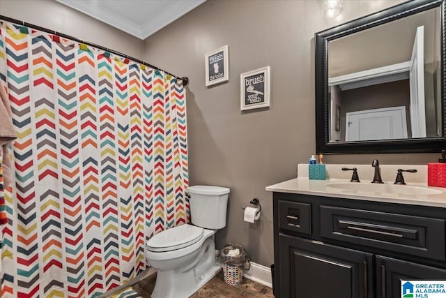 1520 Day Gap Rd, Cullman, AL 35057 - bathroom with crown molding, vanity, wood finished floors, toilet, and baseboards