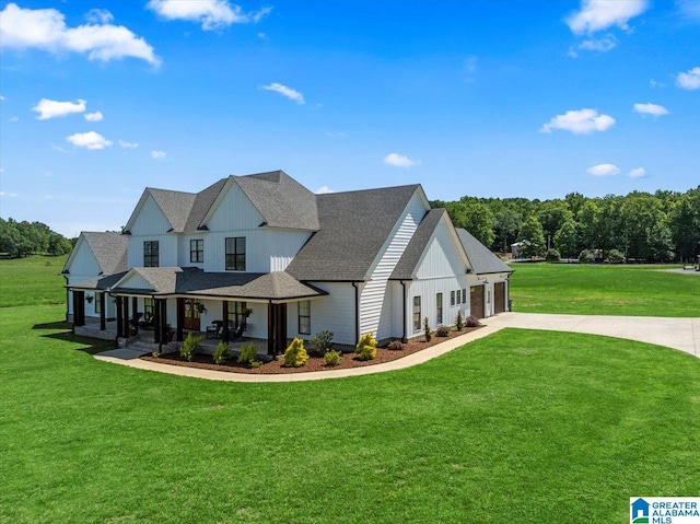 1520 Day Gap Rd, Cullman, AL 35057 - modern farmhouse featuring a front lawn, an attached garage, board and batten siding, concrete driveway, and a porch