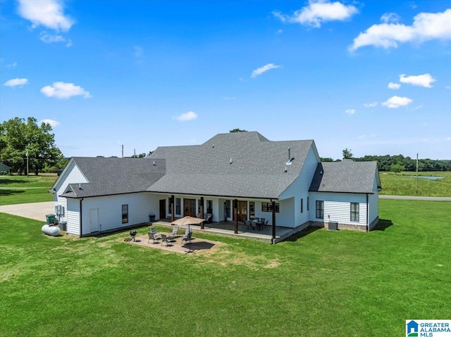 1520 Day Gap Rd, Cullman, AL 35057 - back of property with a lawn, a shingled roof, and a patio
