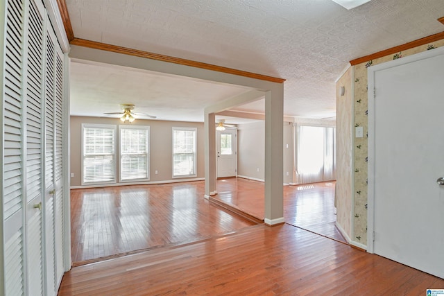 2928 University Way, Centreville, AL 35042 - unfurnished living room featuring wood-type flooring, a ceiling fan, and baseboards