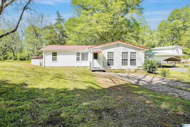 2928 University Way, Centreville, AL 35042 - manufactured / mobile home with a front lawn, a detached carport, and metal roof