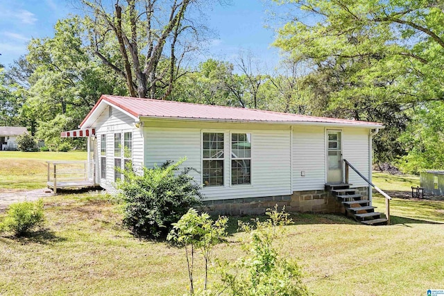 2928 University Way, Centreville, AL 35042 - exterior space featuring entry steps, a yard, and metal roof