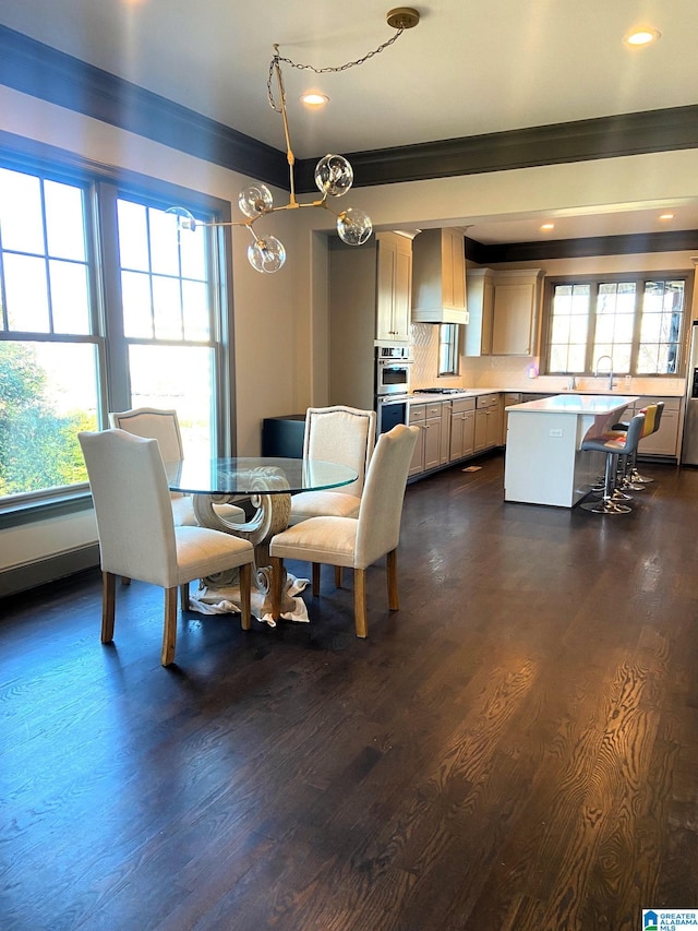 dining space featuring crown molding, recessed lighting, dark wood-style floors, and plenty of natural light