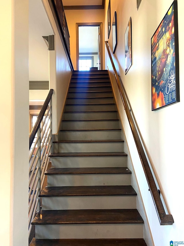 stairs featuring a towering ceiling