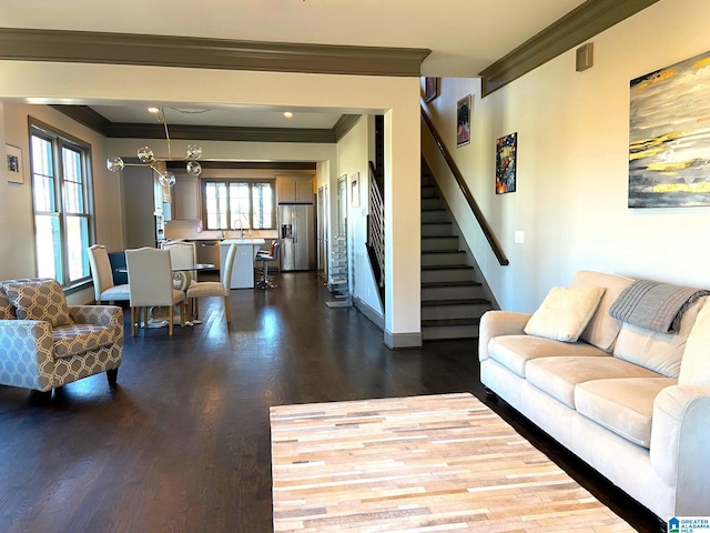 living area with stairs, baseboards, ornamental molding, and dark wood-type flooring