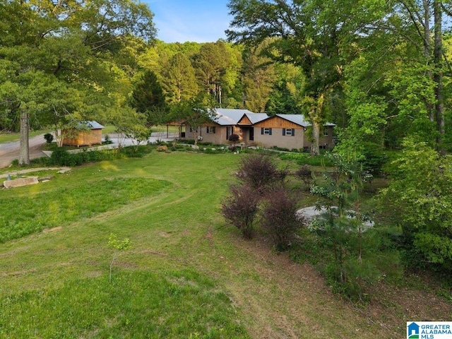 bird's eye view with a forest view