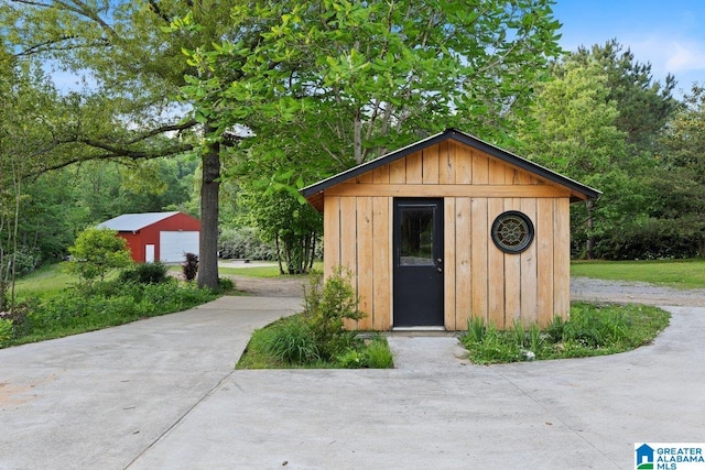 view of shed featuring driveway