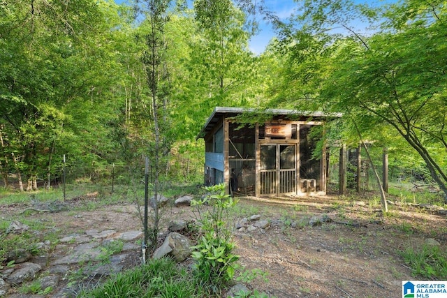 view of poultry coop with a view of trees