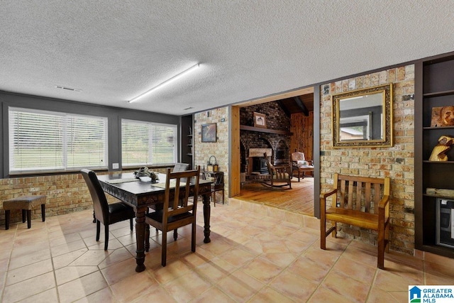 dining room with a textured ceiling and visible vents