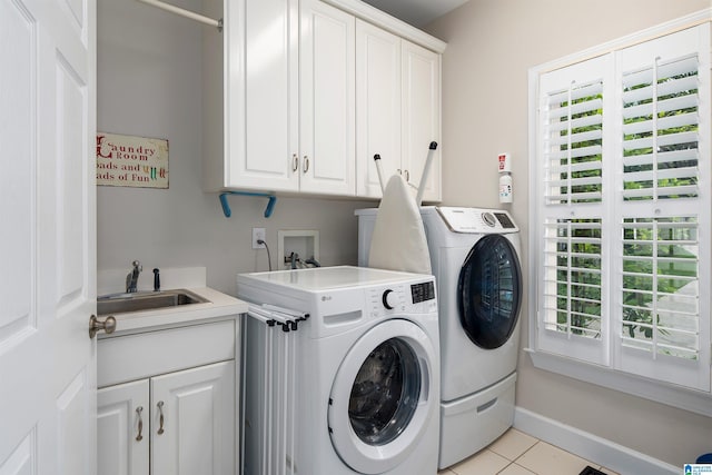 1012 Oak Tree Rd, Hoover, AL 35244 - clothes washing area featuring plenty of natural light, cabinet space, a sink, light tile patterned floors, and washer and dryer