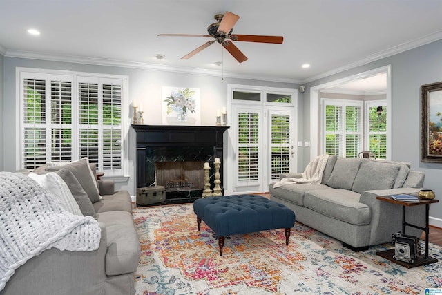 1012 Oak Tree Rd, Hoover, AL 35244 - living area with crown molding, baseboards, ceiling fan, recessed lighting, and a premium fireplace