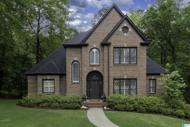 1012 Oak Tree Rd, Hoover, AL 35244 - view of front of home featuring brick siding, roof with shingles, and a front yard