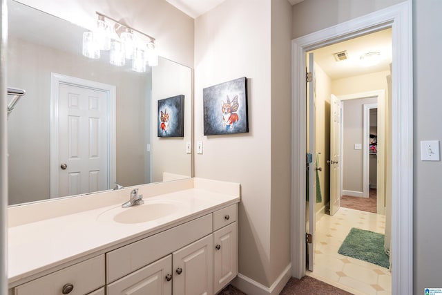 1012 Oak Tree Rd, Hoover, AL 35244 - bathroom featuring vanity, baseboards, and visible vents