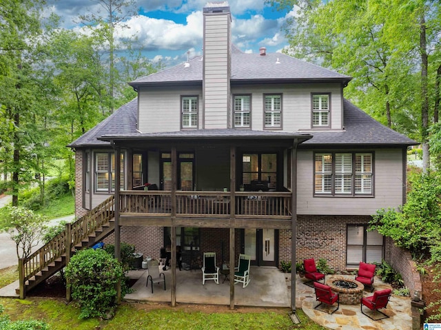 1012 Oak Tree Rd, Hoover, AL 35244 - back of house with a shingled roof, a fire pit, stairway, and a patio area