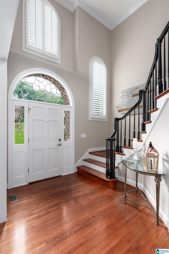 1012 Oak Tree Rd, Hoover, AL 35244 - foyer entrance with stairway, baseboards, ornamental molding, and wood finished floors