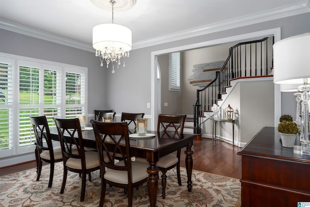 1012 Oak Tree Rd, Hoover, AL 35244 - dining area with crown molding, stairs, a chandelier, and wood finished floors