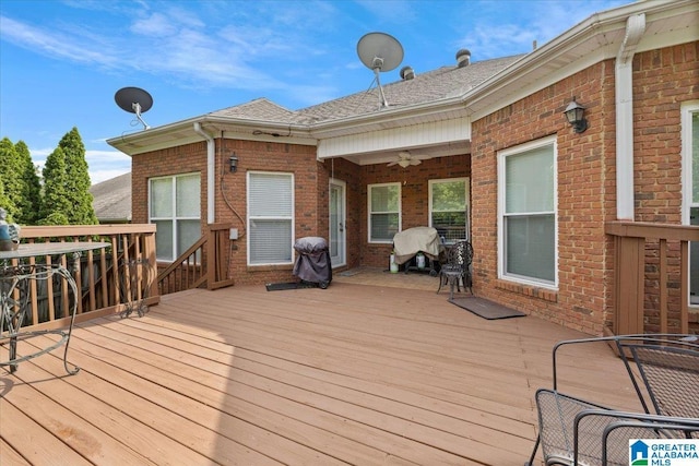 wooden deck featuring a ceiling fan