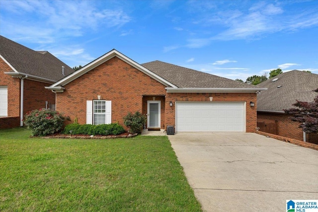 traditional-style home with concrete driveway, brick siding, a front lawn, and an attached garage