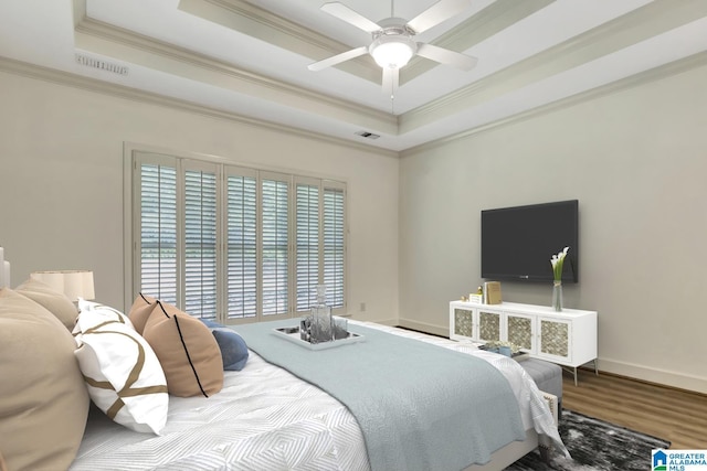 bedroom featuring a ceiling fan, a tray ceiling, visible vents, baseboards, and ornamental molding