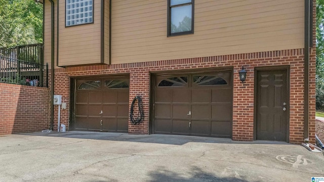 garage with concrete driveway