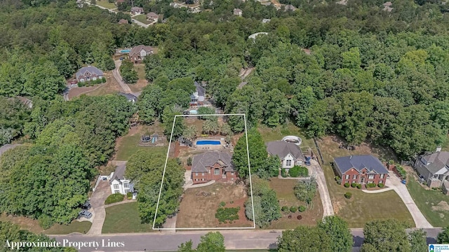 birds eye view of property with a residential view
