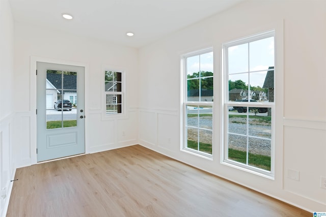 377 Shiloh Creek Dr, Calera, AL 35040 - doorway to outside featuring a decorative wall, light wood-style flooring, wainscoting, and recessed lighting