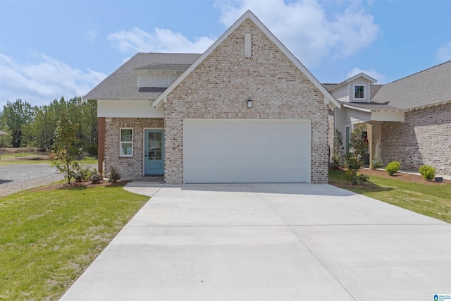 377 Shiloh Creek Dr, Calera, AL 35040 - view of front of house with brick siding, a garage, concrete driveway, a front lawn, and roof with shingles