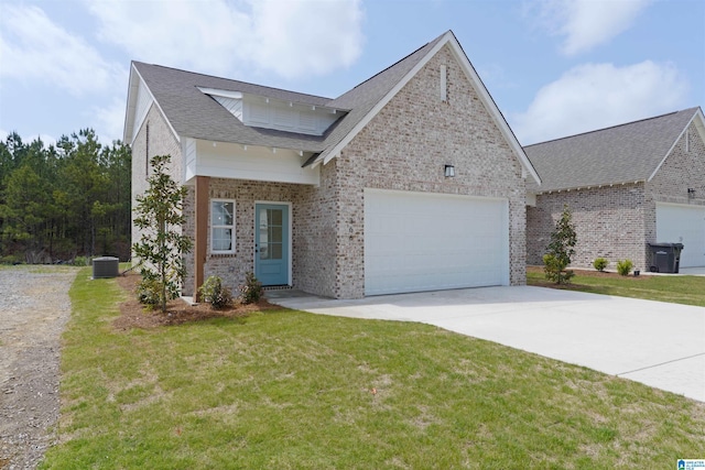377 Shiloh Creek Dr, Calera, AL 35040 - view of front of house featuring brick siding, driveway, central AC unit, an attached garage, and a front yard