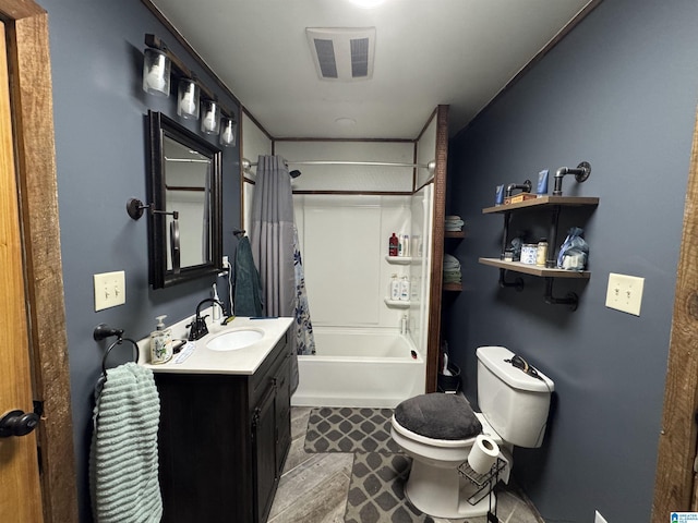 bathroom with vanity, visible vents, toilet, and shower / tub combo