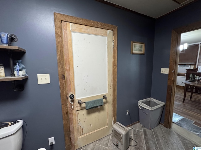 entryway with baseboards and wood finished floors